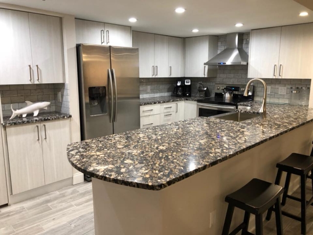 Totally remodeled kitchen with new all wood cabinets and granite counter tops.